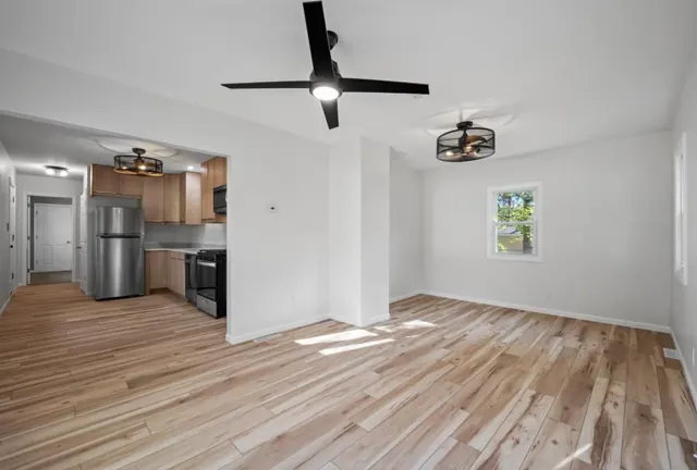 Open living area with new flooring, paint and ceiling fans, Twin Cities
