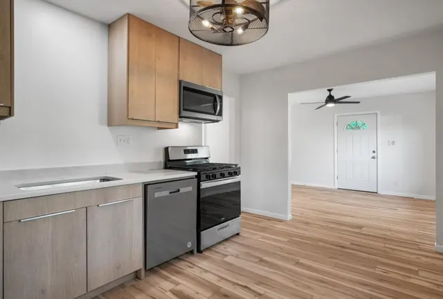 Kitchen open to the living room with new flooring, Twin Cities